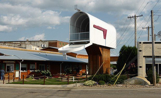 he world&rsquo;s largest mailbox in Casey, Illinois, sports a red flag that can be raised when mail is ready to go. At 32 feet tall, the working mailbox towers over downtown Casey, which boasts eight world records. - PHOTO BY BRENT BOHLEN